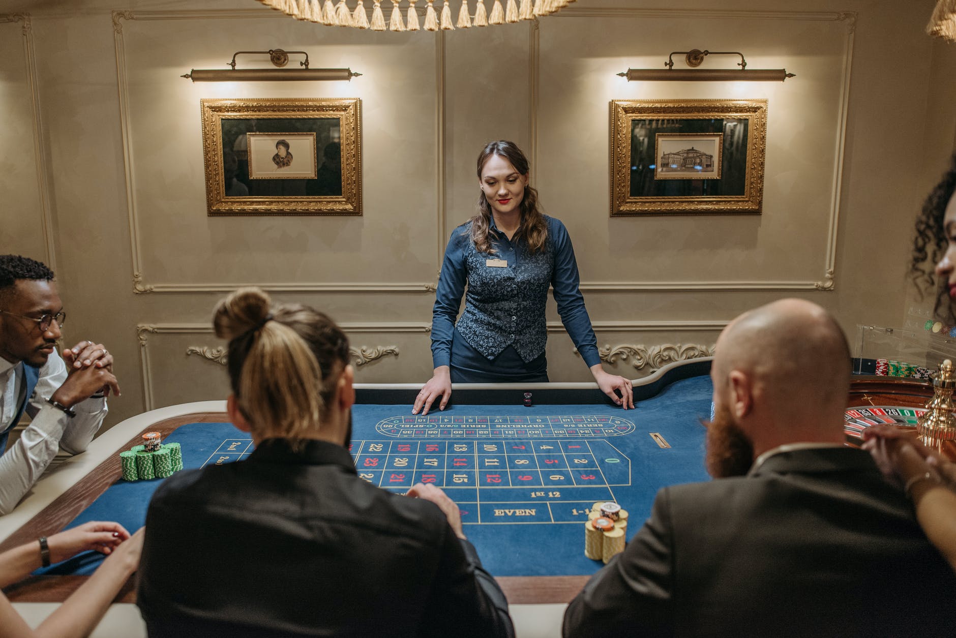 players betting on a roulette table