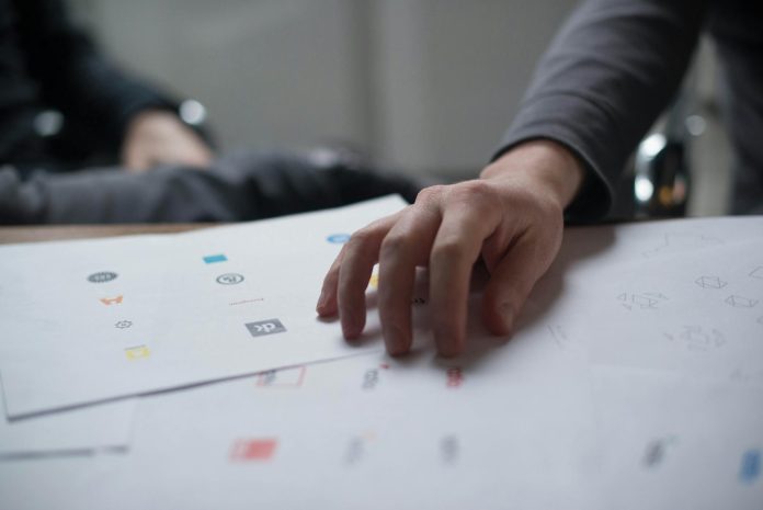 hand on top of paper